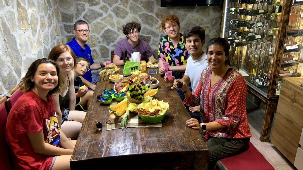 family sitting to eat out to dinner