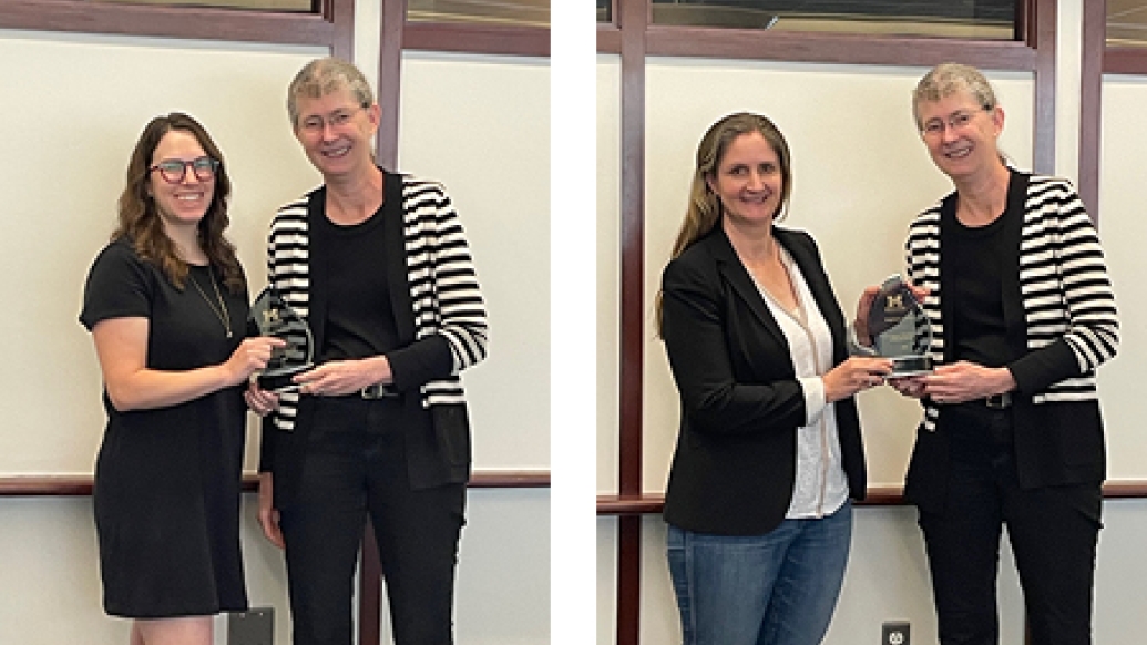 Brittany Bowman, PhD, and Stefanie Galban, PhD pose for a photo with their awards