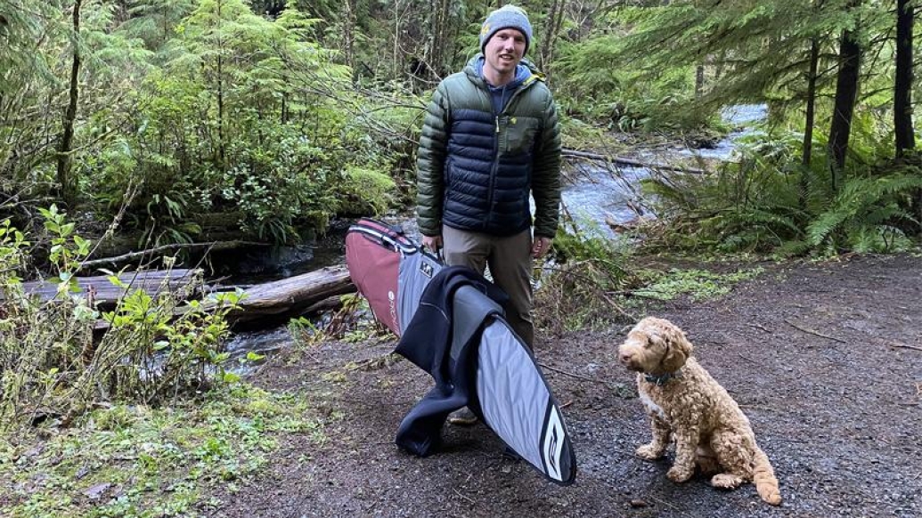 Brandon in the forest with his dog