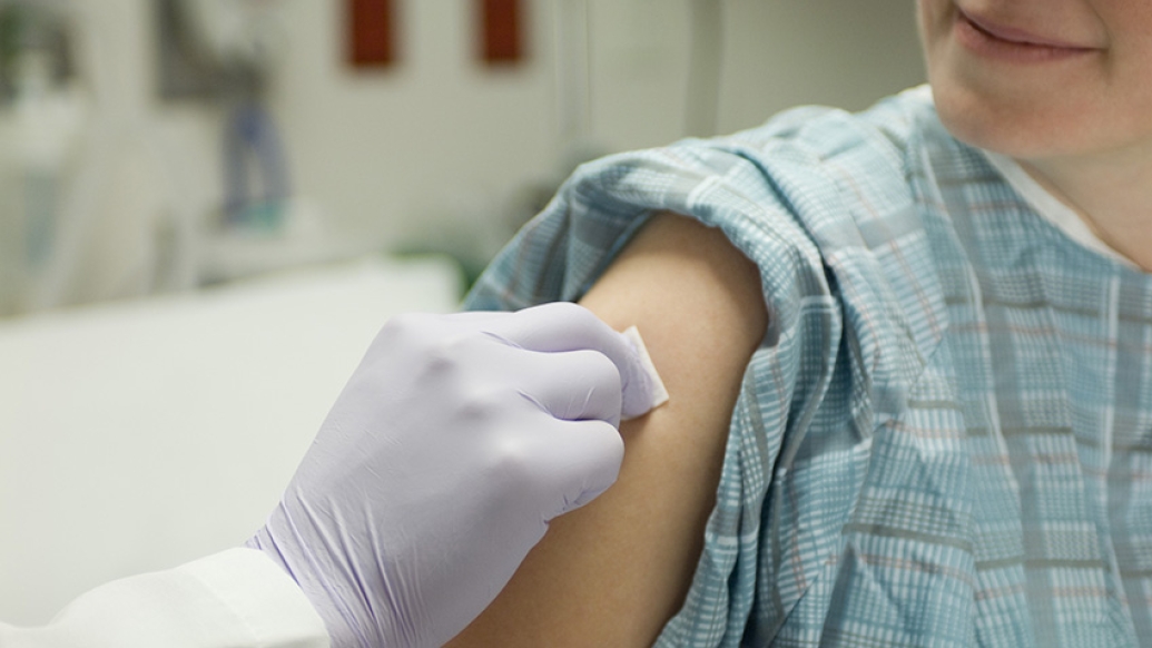 Pregnant woman receives her flu shot and Tdap vaccine during her third trimester