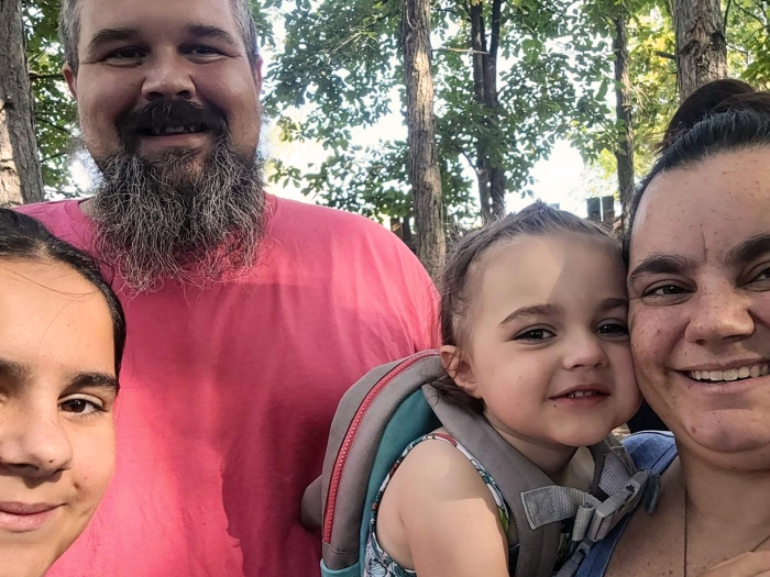 family standing together selfie