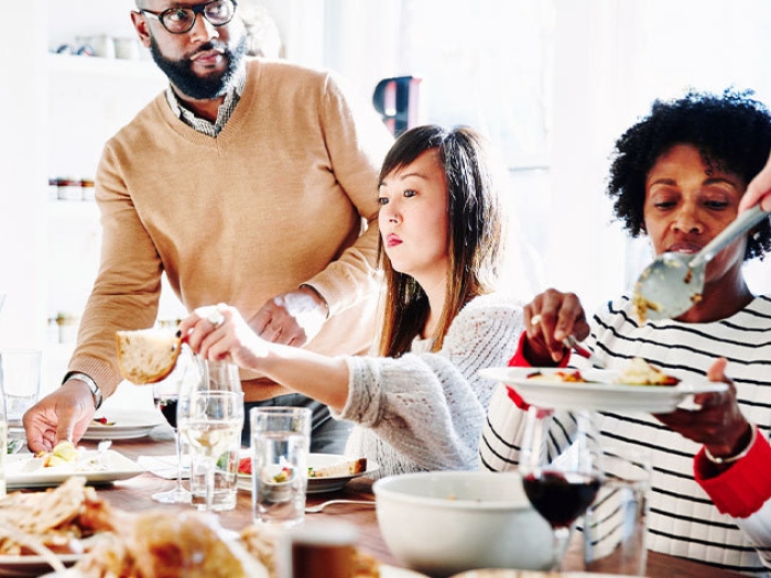 friends adults thanksgiving dinner table