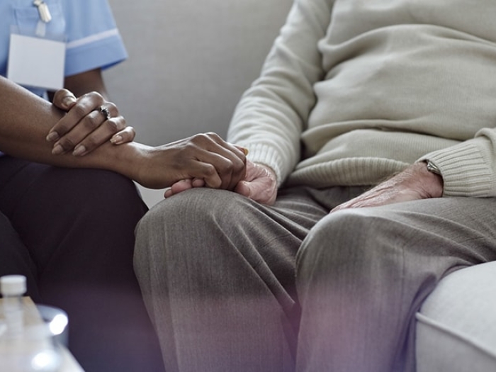 A doctor sharing a cancer diagnosis with a patient