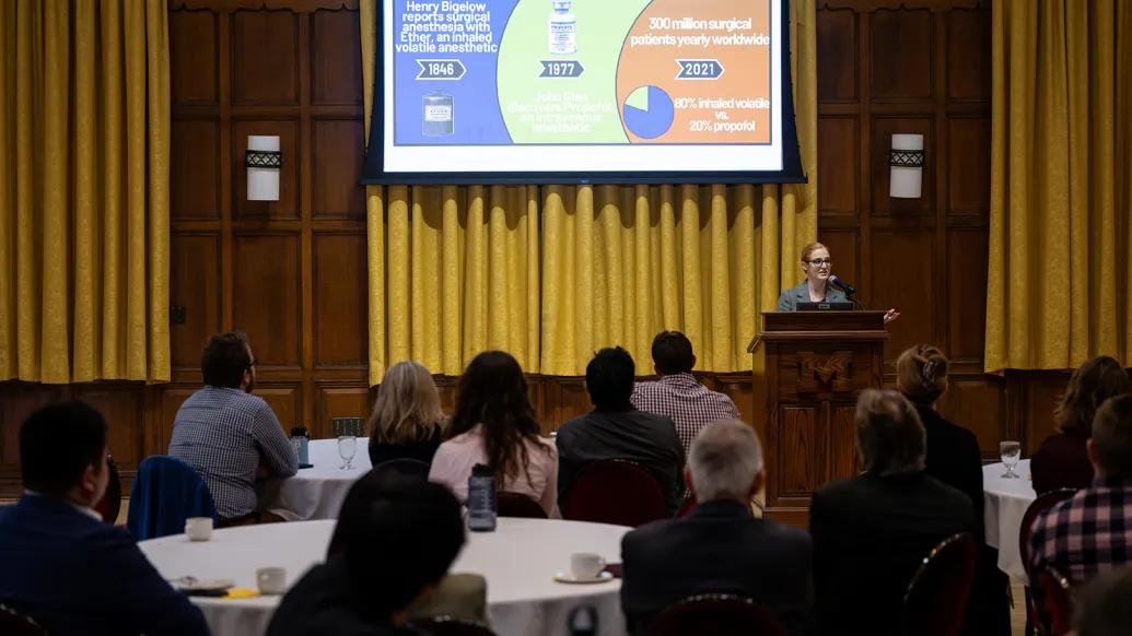 Allison Janda, M.D. presents at the podium