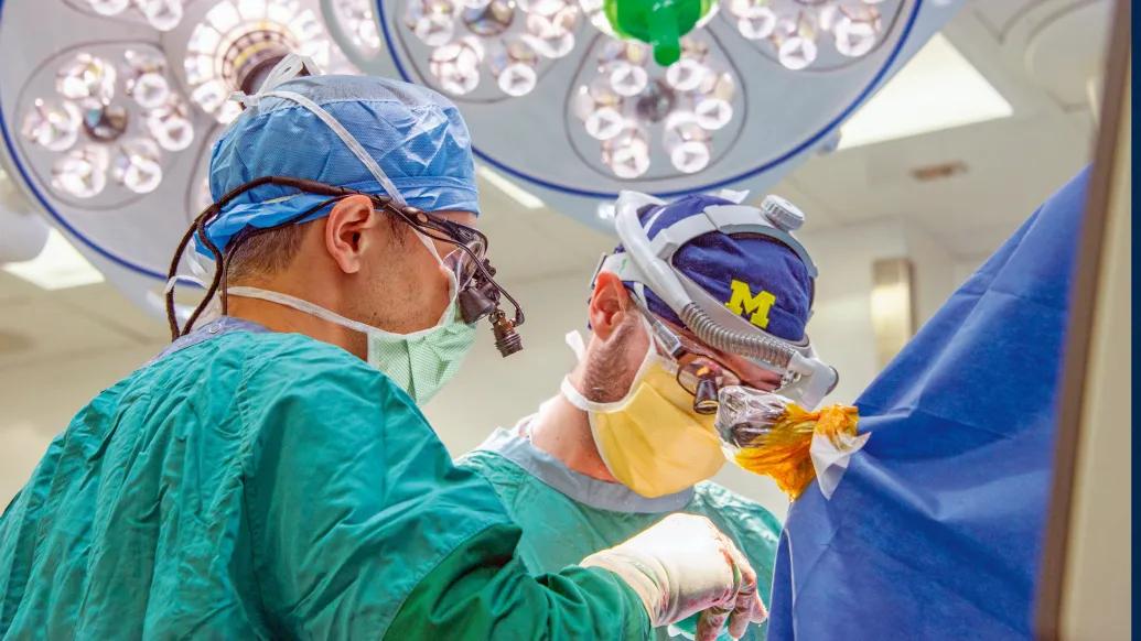 surgeon close up operating in bright lighted room