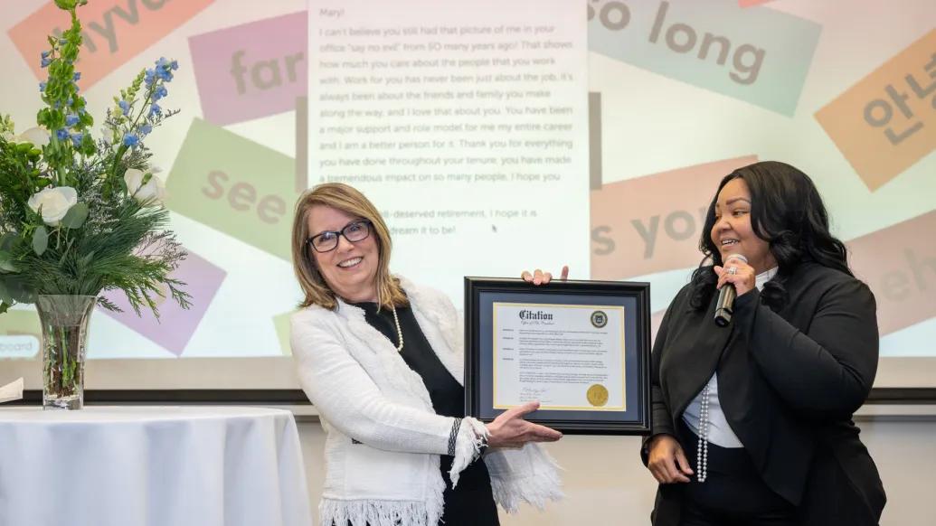 Mary Freer receives Presidential Citation from Lynnetta Smith, on behalf of President Ono