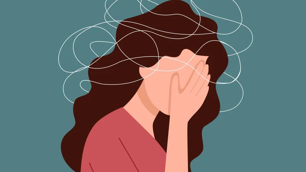 woman with hand covering face