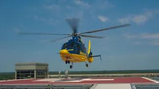 survival flight helicopter landing on the helipad 