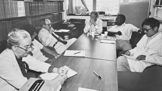 Historic photo of Duell Voorhees research meeting