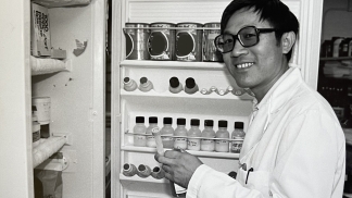 A researcher smiles in the lab in 1979