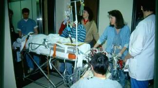 Medical team members moving a stretcher in the hospital