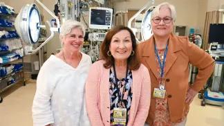 Team members in room with medical equipment