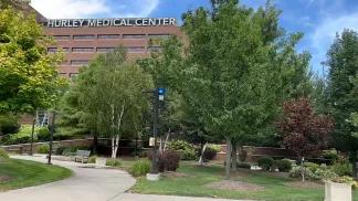 Hurley Medical Center building with trees