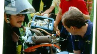 First responders helping a patient on a stretcher