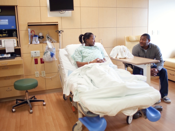 Labor and Delivery room with patients sitting in bad