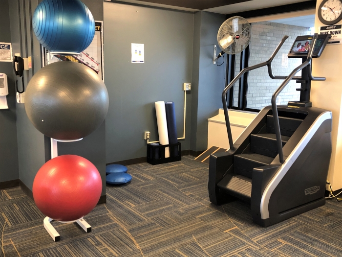 stair stepper and rubber balls in common area of wellness center