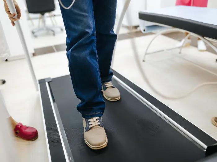 person walking on treadmill
