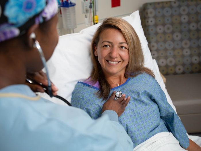 patient smiling back at doctor 