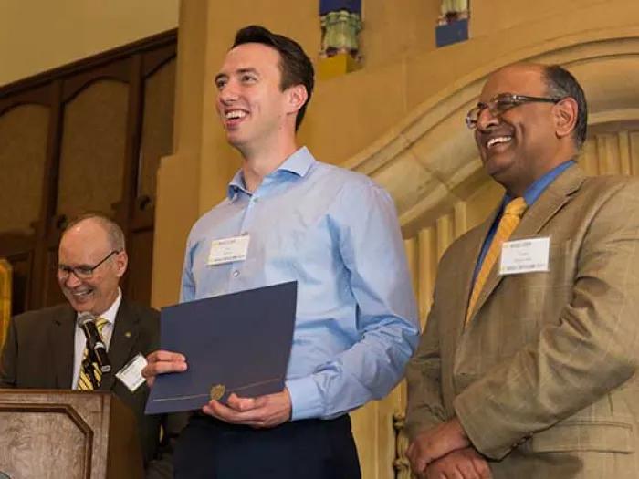 Student accepting award at the Graduation Awards Luncheon and Awards Ceremony