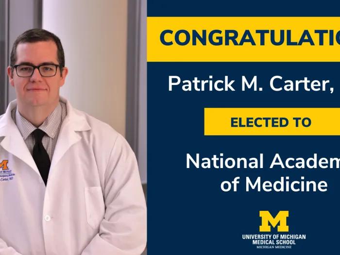 Carter in white coat, inducted to NAM