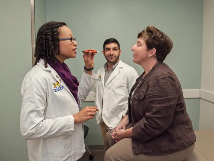 A doctor working with a patient in an observation room