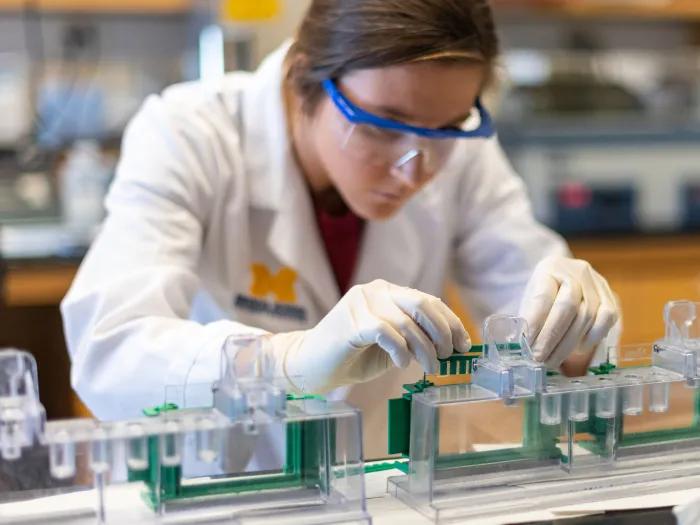 A person working with lab equipment