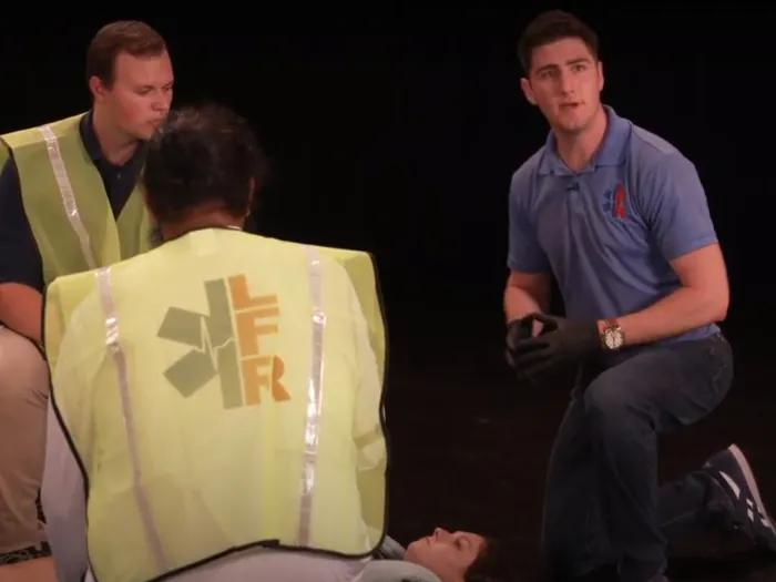 Medical student Zach Eisner (right) leads an lay-first responder exercise with U-M student actors for an online training curriculum aimed at LMIC settings.