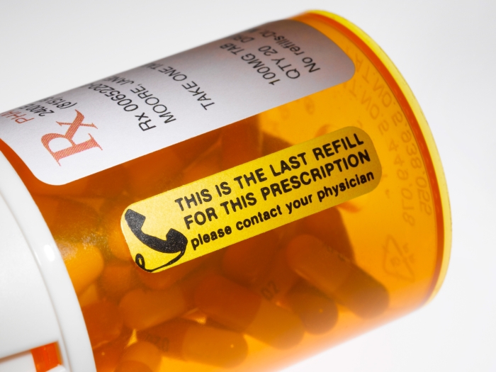 Illustration of prescription bottle with a refill notice