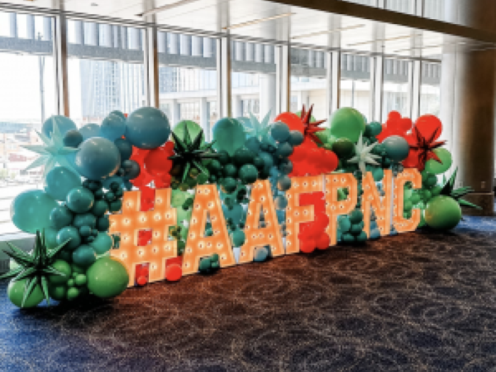 A photo backdrop of the hashtag #AAFPNC