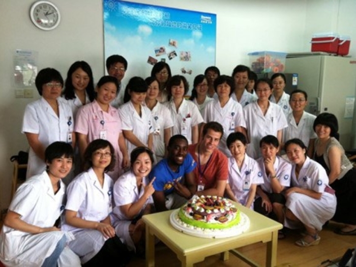 Two rows of people posing for a photo