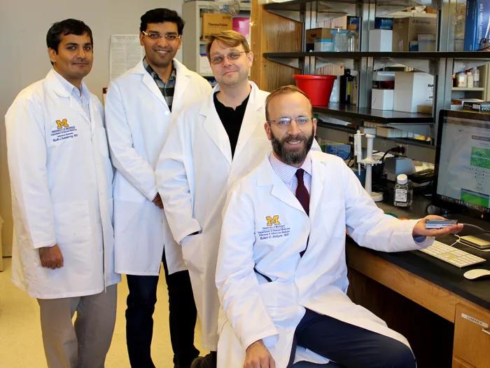 A group of faculty in a lab