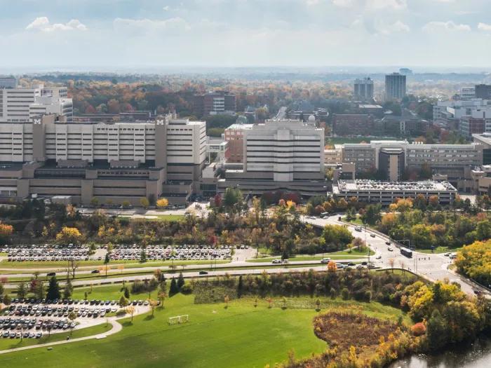 Aerial shot of the Michigan campus with buildings, lawns, and trees