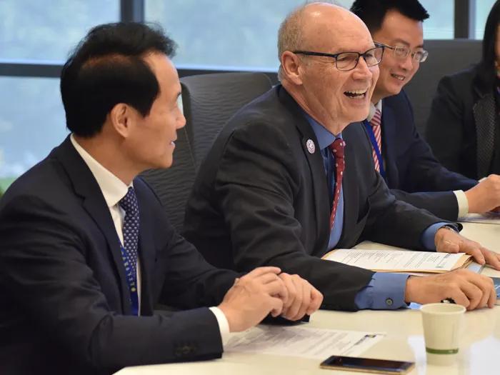 A group of presenters sitting at a table