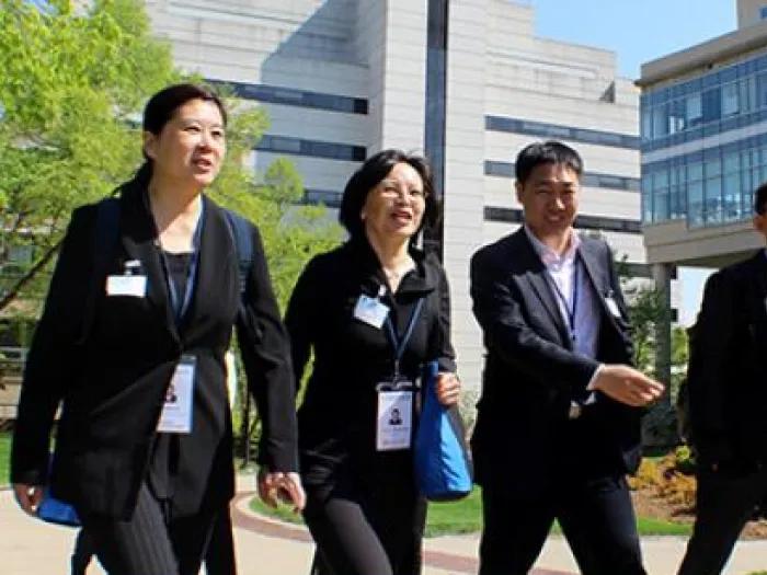 A group of people walking outside