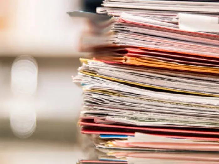 A stack of papers and folders