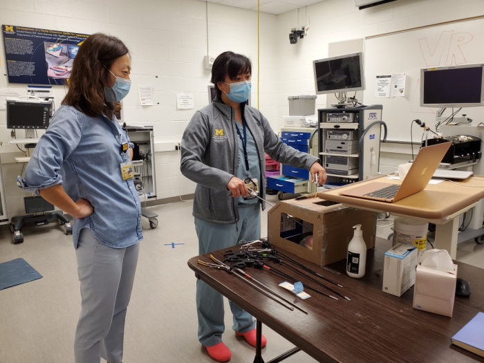 Two people working on a simulation in a lab