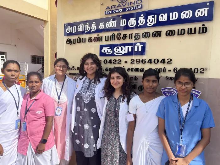Medical students Siddhi Deshpande and Hanin Elhagehassan with the vision center team in India