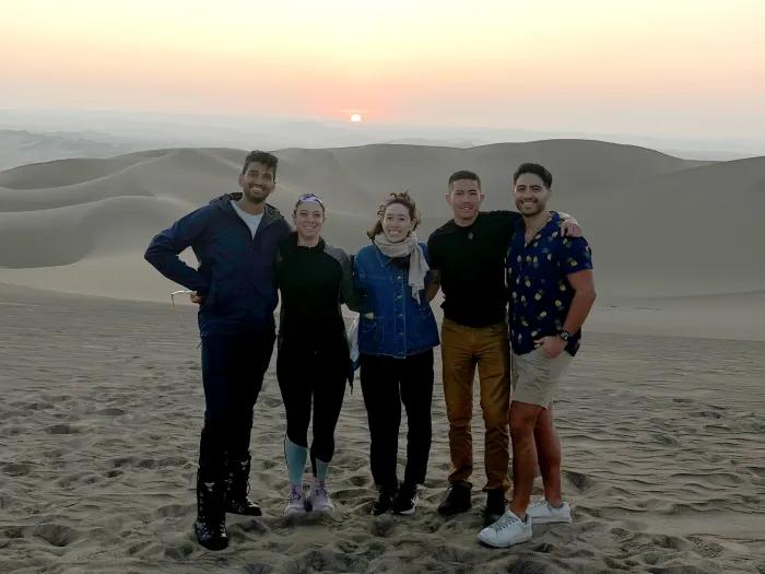UMMS student Reni Forer (second from left) with other Fogarty Fellows in the desert in the Ica Region of southern Peru.