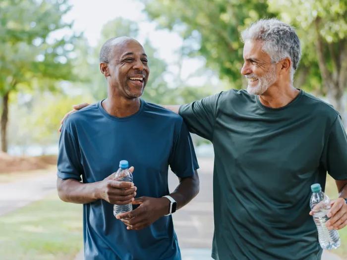two men together walking outside