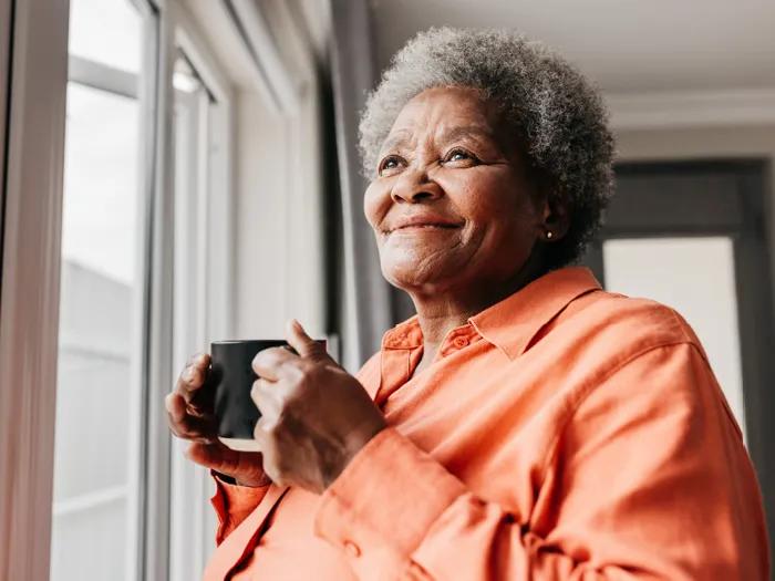 Older adult woman drinking coffee