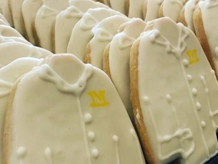 Photo of cookies shaped like white lab coats