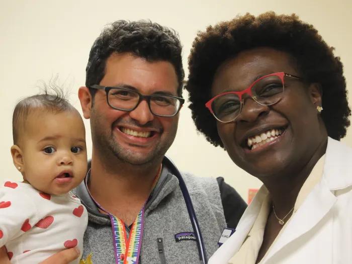 Family medicine team members and baby