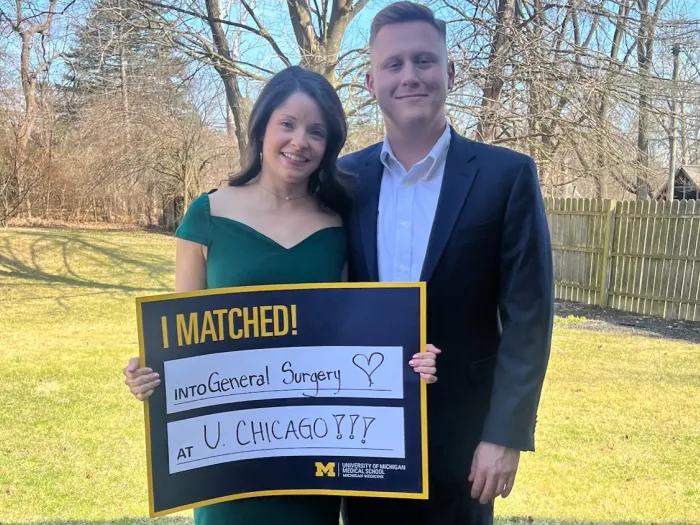 Two people pose with a sign that reads "I Matched! General Surgery, U Chicago!"