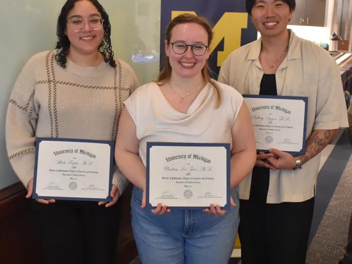 three phd graduates