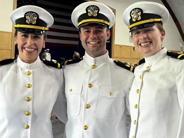 three medical students in military uniform