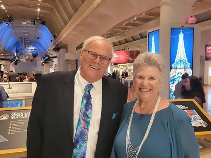 Smiling portrait of Rich and Linda McLaren at a special event. They are wearing formal attire.