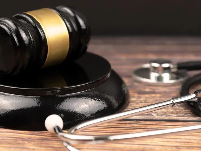 stethoscope close up black and wood table