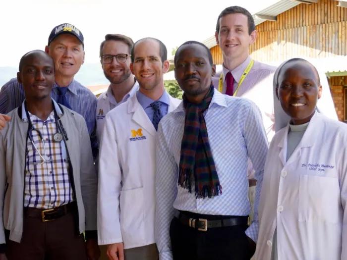 Dr. Kolars in Uganda with UMMS students and partners in 2018.