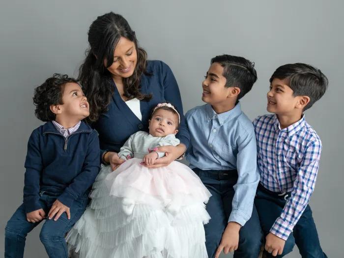 mother with four kids smiling