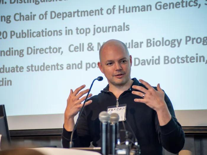 A man standing at a podium presenting